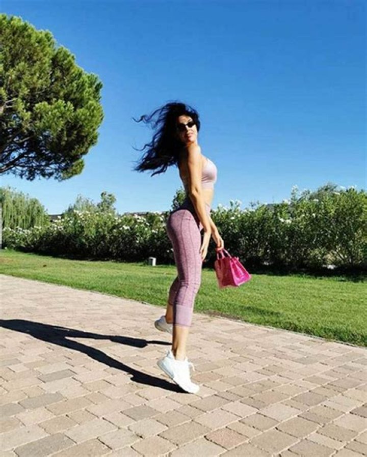 Georgina Rodriguez poses in a dollar bill outfit