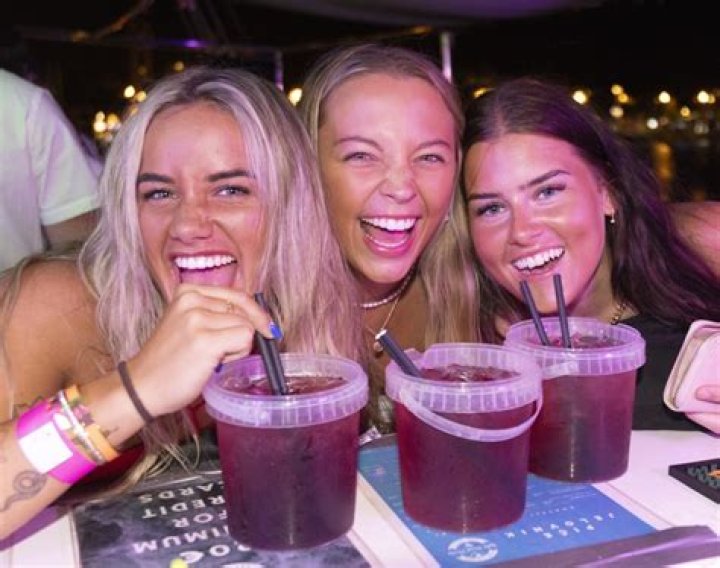 Girls knocking back drinks at ShotGun in the old town