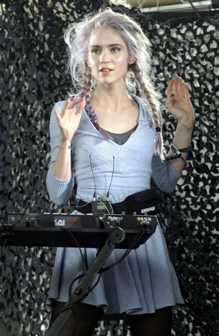 Grimes' new barely-visible, white back tattoo was on display in her dress
