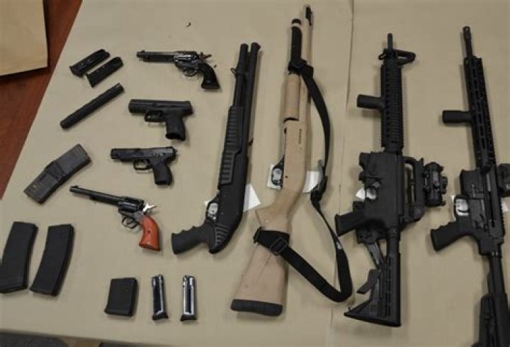 Guns are seen in the hotel room of the gunman after the shooting. Lawsuits alleged MGM was negligent in the incidents