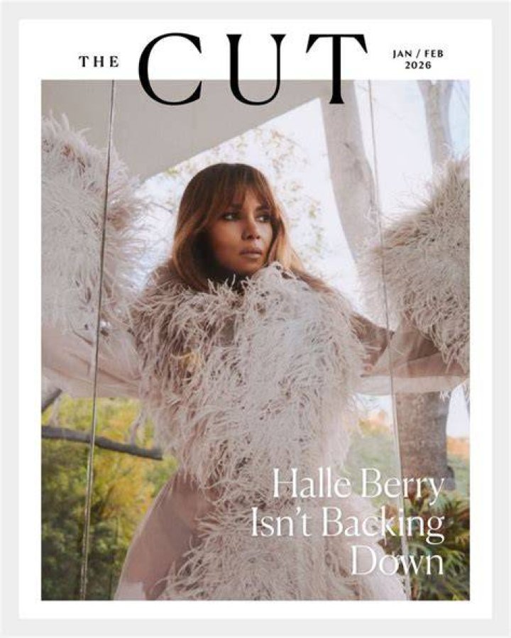 Halle seemed to cover her stomach with a furry black jacket