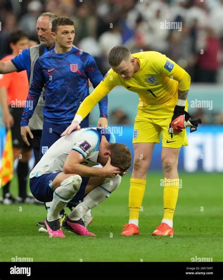 Harry Kane is consoled after England's defeat
