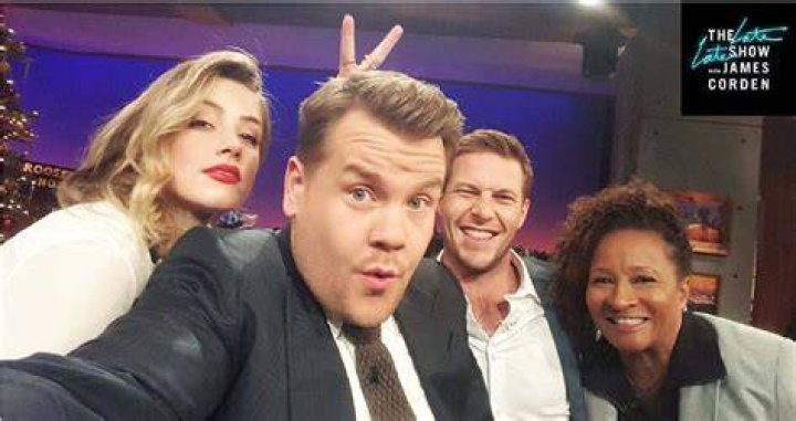 Heard poses with fellow guests Luke Bracey and Wanda Skyes on the Late Late Show with James Corden