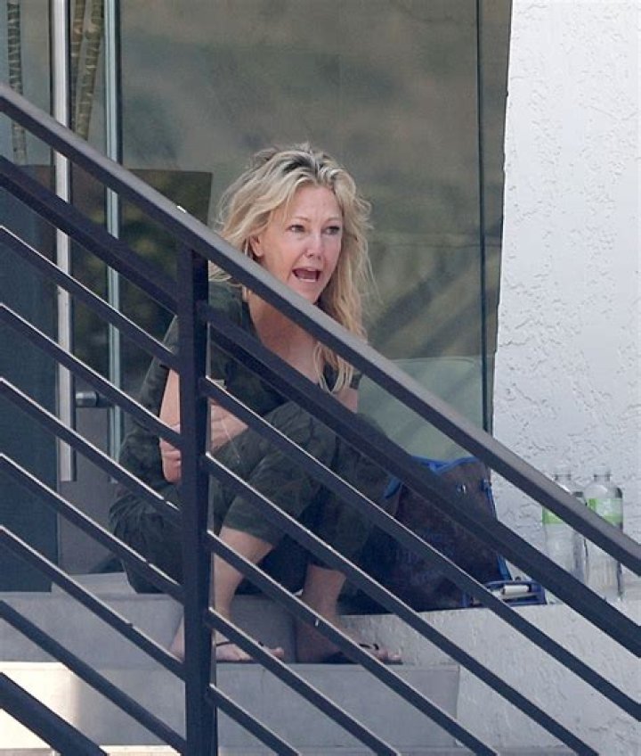 Heather, pictured teetering on ledge in California last week, has suffered a devastating 17-year battle with booze