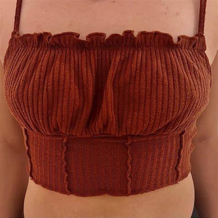 Her crop top barely kept her assets in check