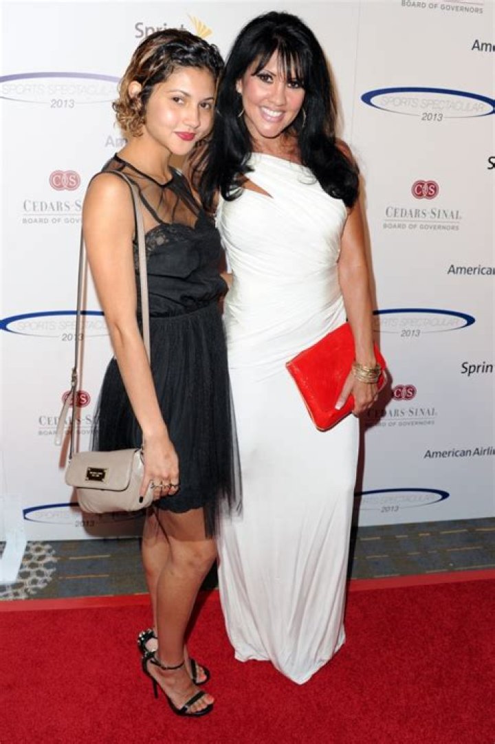 His longtime friend, Mia St. John - pictured here with daughter Paris - is speaking out in an exclusive interview with The U.S. Sun
