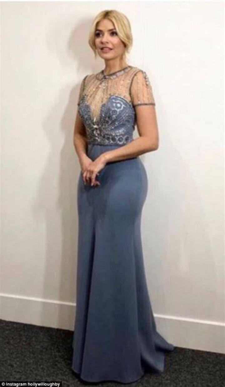 Holly Willoughby who looked impossibly glamorous in a figure-hugging embellished gown