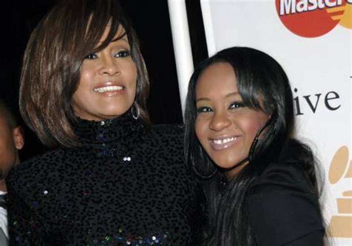  Houston and Bobbi Kristina Brown arrive at the 2011 Pre-GRAMMY Gala