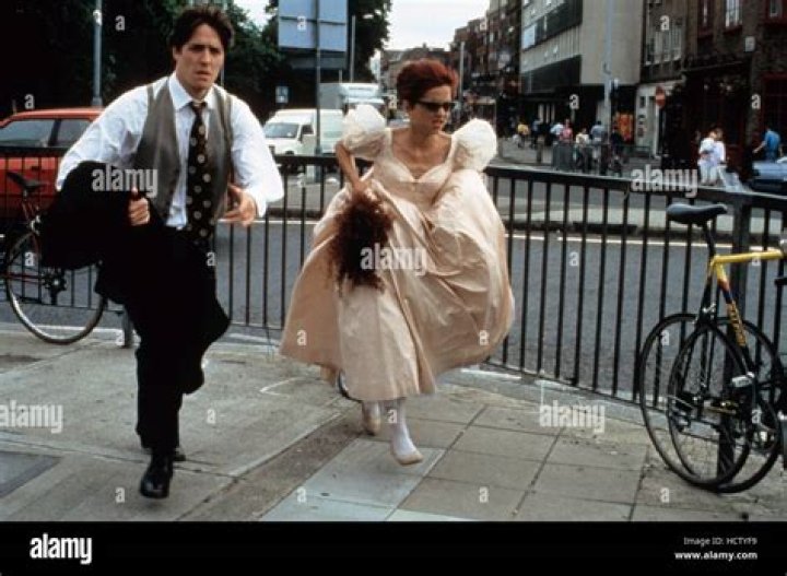 Hugh Grant and Charlotte Coleman dash to the church in Four Weddings