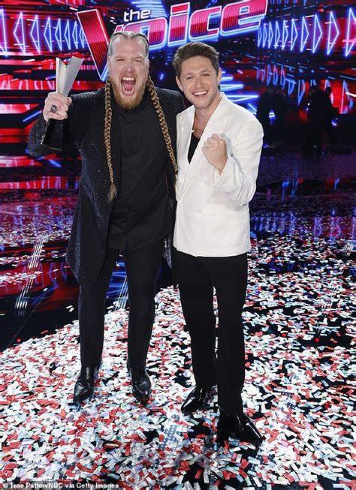 Huntley (left) with coach Niall Horan after winning the 24th season of The Voice on Tuesday
