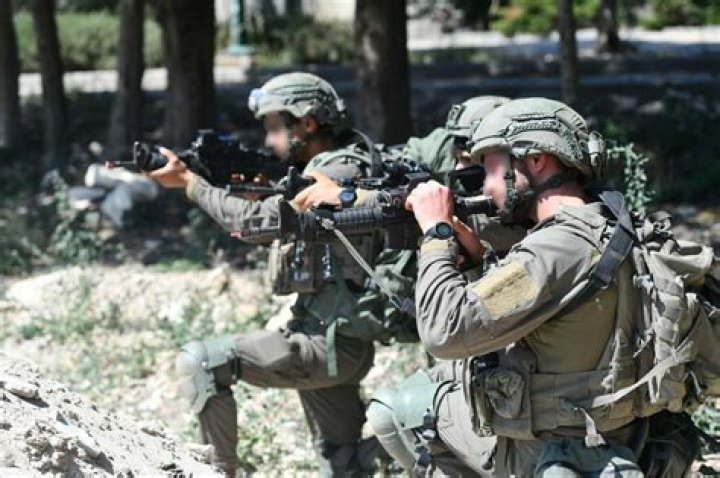 IDF special forces blasted their way into the apartment block to save the pair