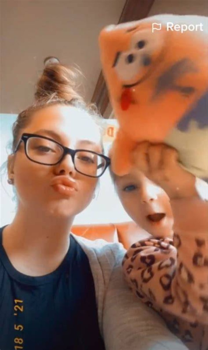 Jade wore glasses and swept her hair up into a topknot