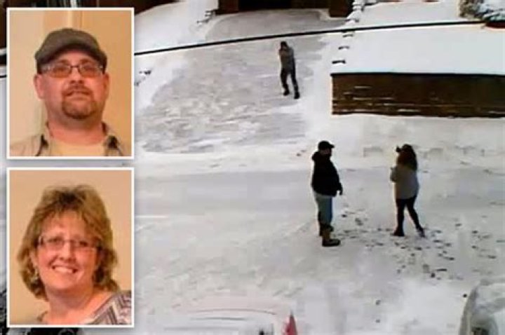 James and Lisa Goy, pictured in the foreground on the right, are seen in the video hurling obscenities at Jeffrey Spaide, pictured in the driveway, during a spat over snow shoveling