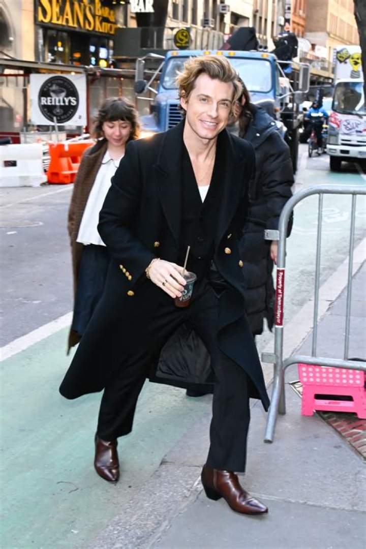 Jeremiah Brent is seen walking and holding an iced coffee on February 20, 2024 in New York City