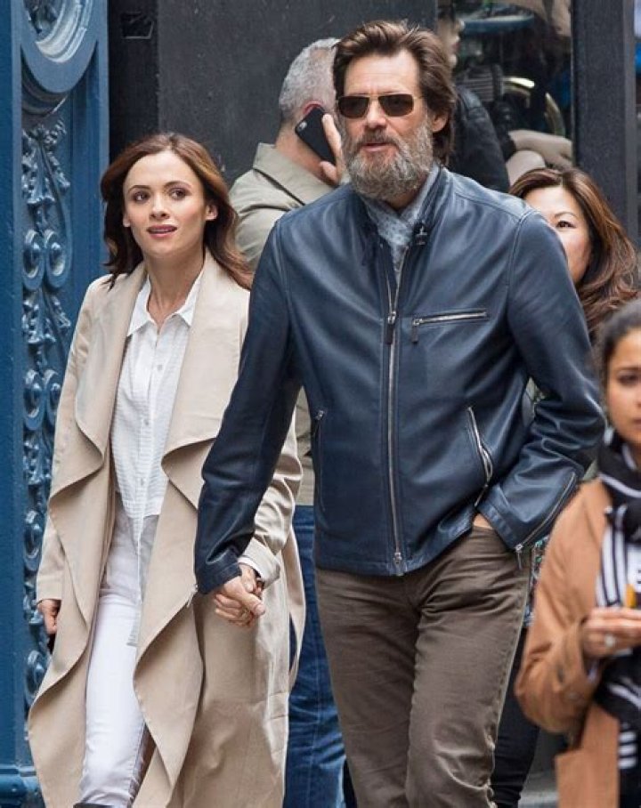 Jim Carrey and Cathriona White, hold hands while taking a walk in Manhattan in 2015.