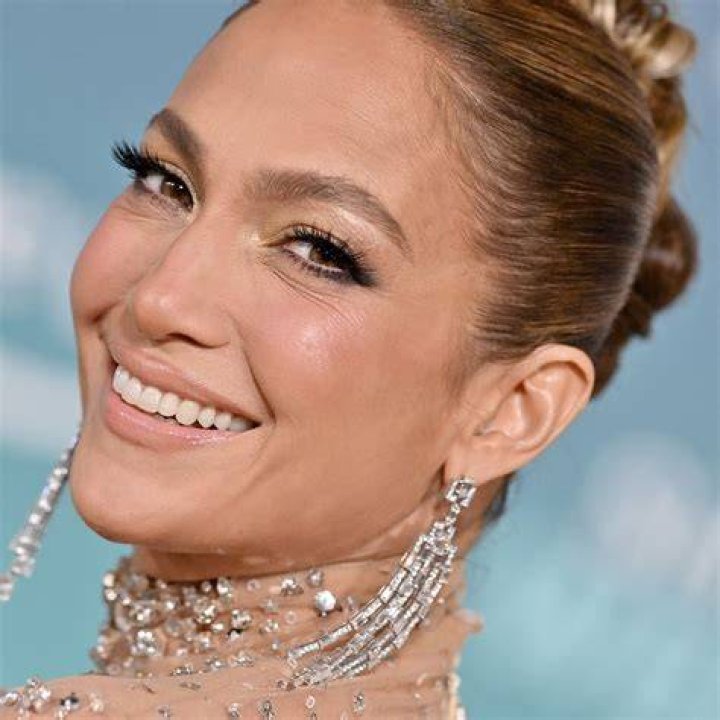 JLo donned a few different looks for the video, including a two-piece red workout outfit