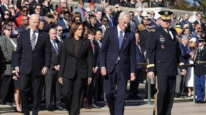 Joe also wore a solemn expression on his face as he walked with his pet dog Bubbles in tow
