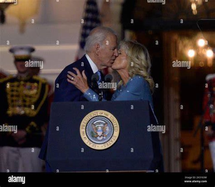 Joe Biden kisses Jill as he was due to be sworn in