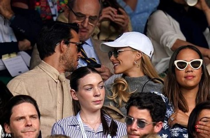Jonathan Bailey (left) chatted to US megastar Ariana Grande (centre) and Andrew Garfield (right) as Tom Hiddleston sat in front