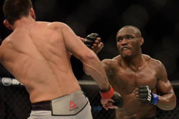 Kamaru Usman (left) will hope to complete a second successful defence of his belt in Abu Dhabi