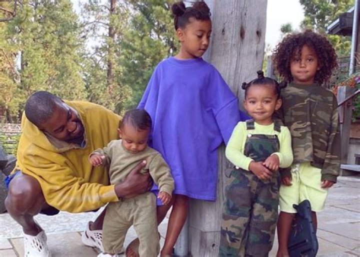 Kanye poses with his children