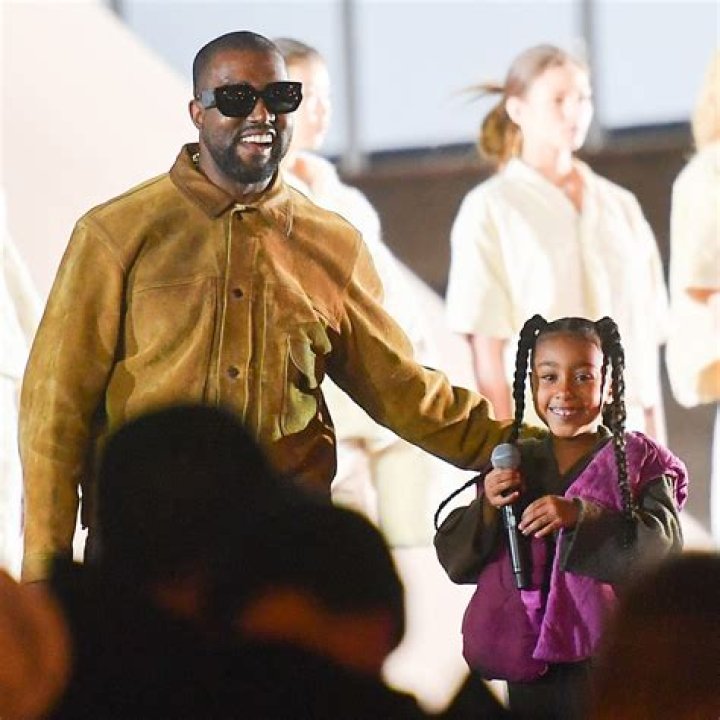 Kanye West emerged from his childhood house in flames