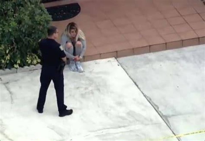  Karina Corbalan can be seen sitting beside the crime scene
