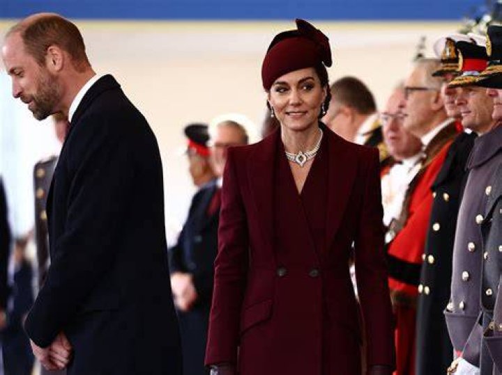 Kate stepped out in a scarlet Alexander McQueen suit