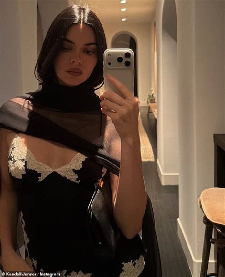 Kendall Jenner showed off her curves in a colorful bikini amid speculation that she has had a secret boob job