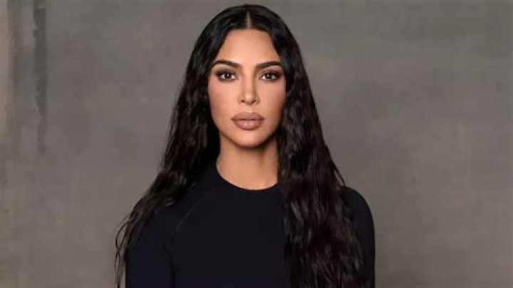 Kim Kardashian posed in a skintight nude bodysuit while promoting a free $10,000 giveaway