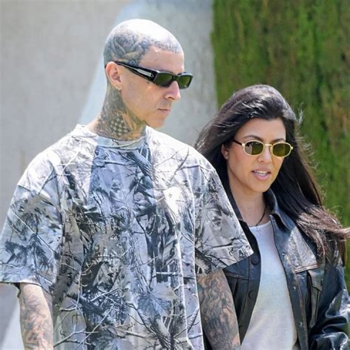 Kim Kardashian walked to Kourtney's ceremony Sunday with daughter North West, 8, and nephew Reign Disick, 7