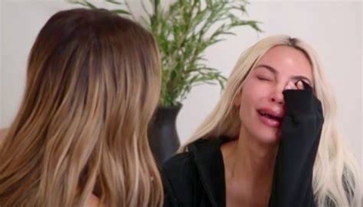 Kim sobs after she finds a spider on her shoulder