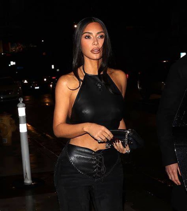 Kim wore a crop top with leather pants at the event