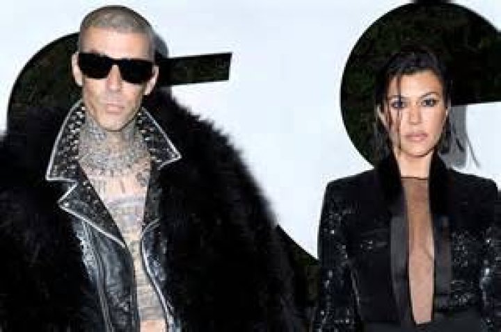 Kourtney and Travis Barker pictured with their children