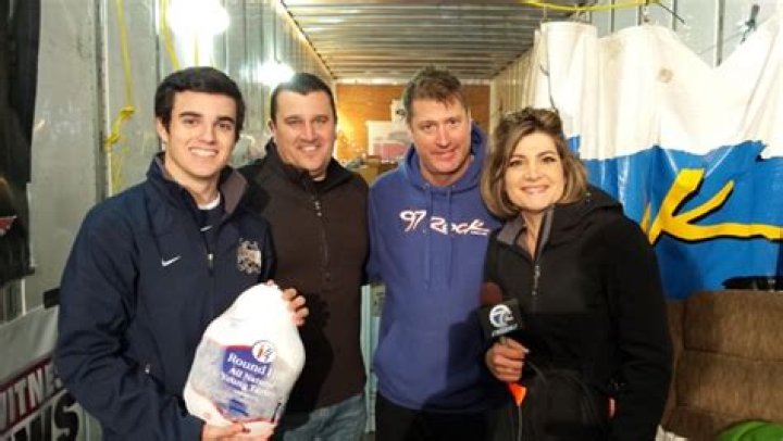 Kurt Villani (center left) is seen donating turkeys with his son (left) years before he died in a dramatic car crash