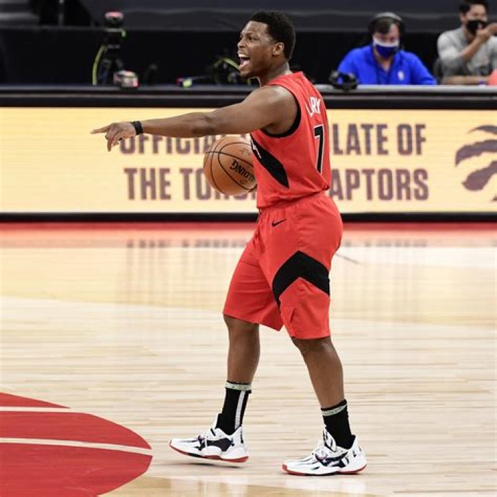 Kyle Lowry walking away from his parked Ferrari 812 GTS in 2021