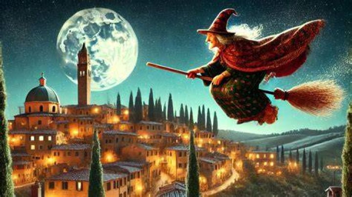 La Befana is seen here paddling a boat, as opposed to riding on a broom 