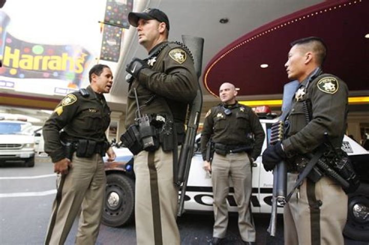 Las Vegas police stand guard along the streets outside the Route 91 Harvest country music festival in Las Vegas on October 1, 2017.