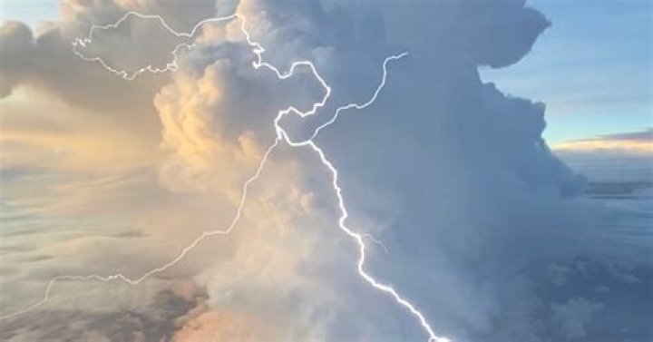 Lightning could be seen during the fire fight, as storms threaten the Omaha area