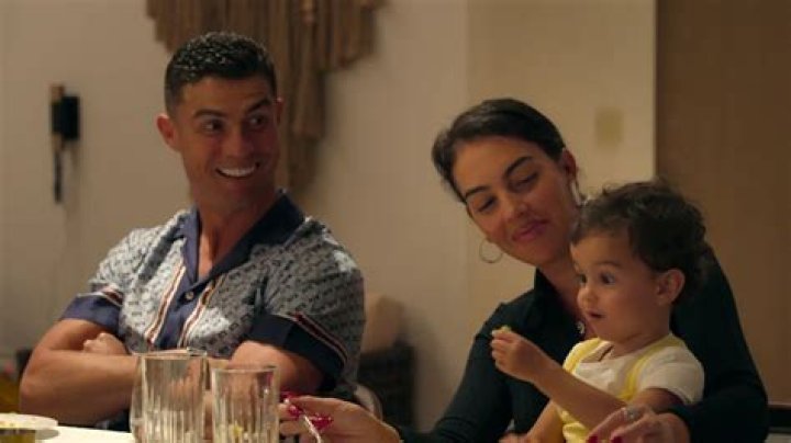 Looking back with love, Georgina displays the dress and Ronaldo's note
