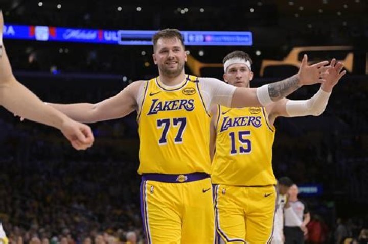 Luke Doncic leaning on his Zastava 750 car that&rsquo;s modeled after Fiat 600