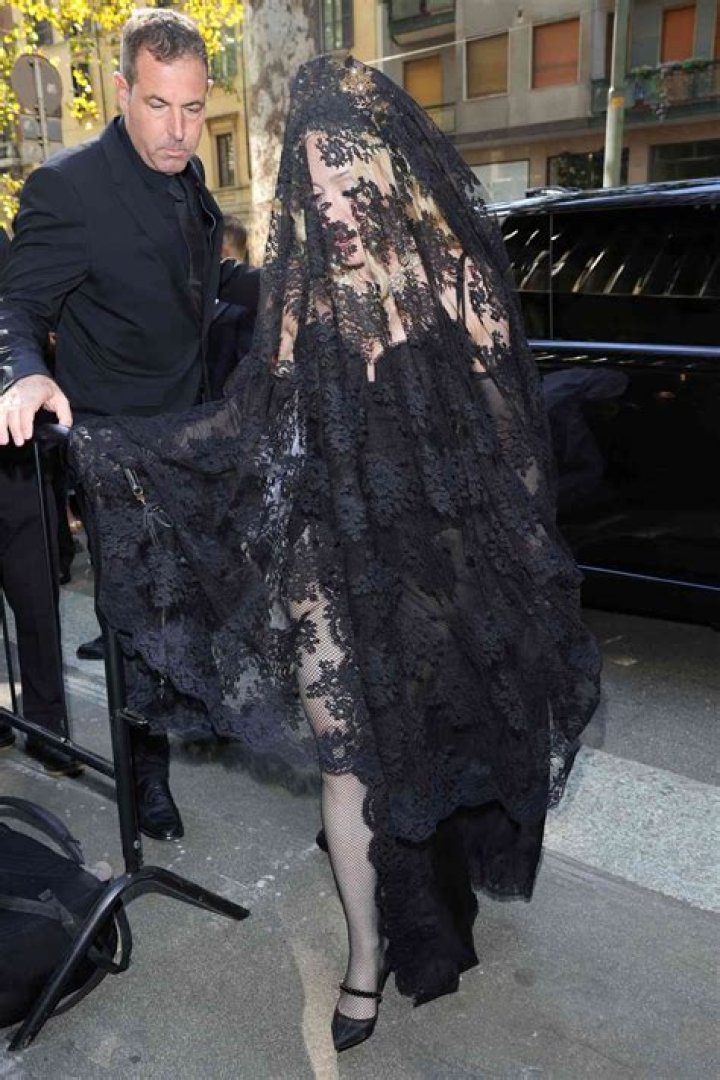 Madonna posed on and off a bed in the photos