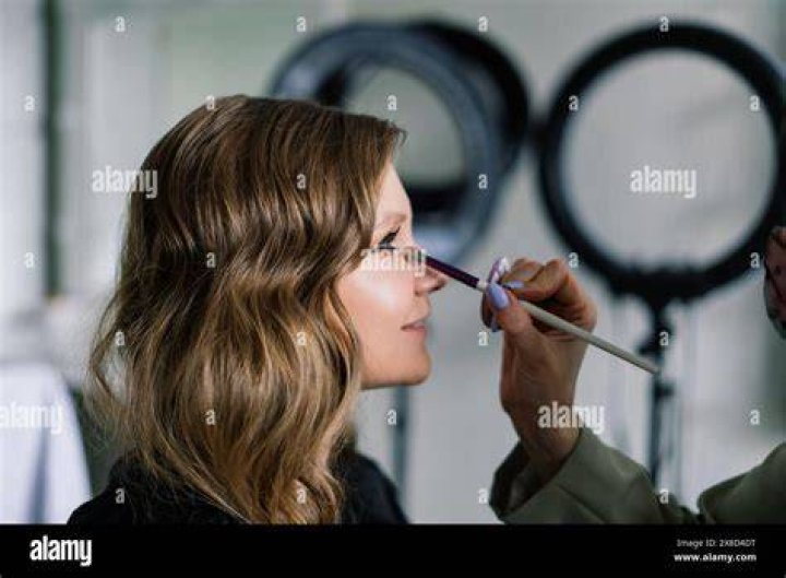 Make-up artist Aimee applies a matte foundation in a tan shade, called Sculpted by Aimee Connolly Second Skin