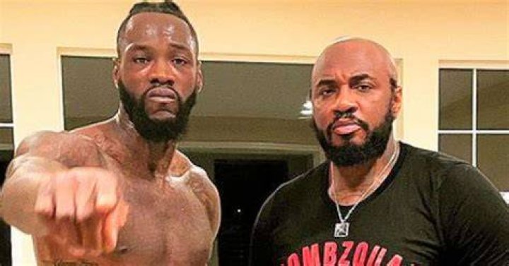 Malik Scott, left, next to Deontay Wilder