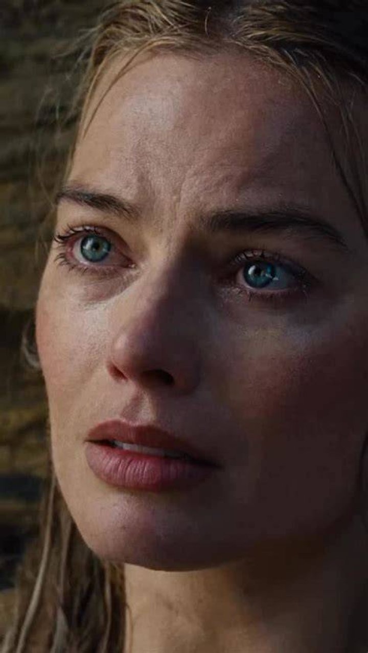 Margot first appears as a 10ft-high glamazon in a striped swimsuit and red lipstick