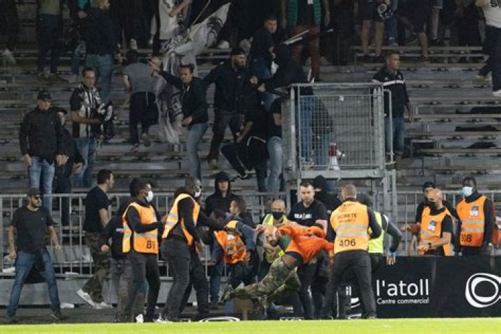 Marseille fans overwhelmed security to reach the Stade Raymond Kopa pitch
