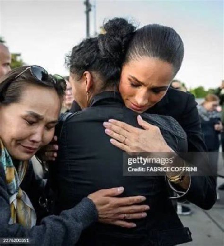 Meghan was also captured by co-star Rick giggling next to 'work wife' Sarah Grafferty