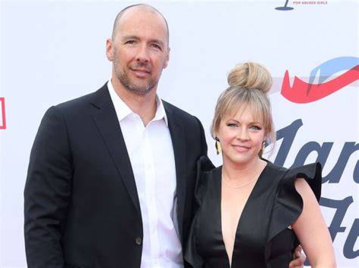 Melissa Joan Hart and Mark Wilkerson arrive at the 4th Annual GRAMMY Awards Viewing Party Hollywood Palladium on April 03, 2022, in Los Angeles, California
