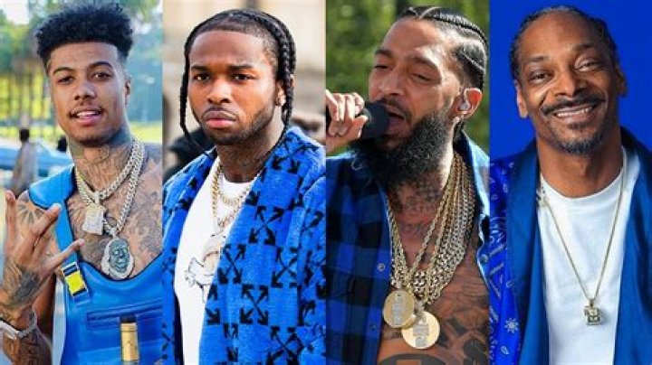 Members of the Crips gang throw up signs from a car window