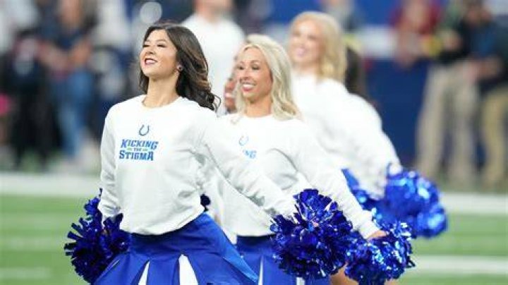  Members of the Indianapolis Colts cheerleading squad perform an acrobatic stunt